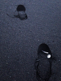 Footprints on Iceland's Black Sand Beach